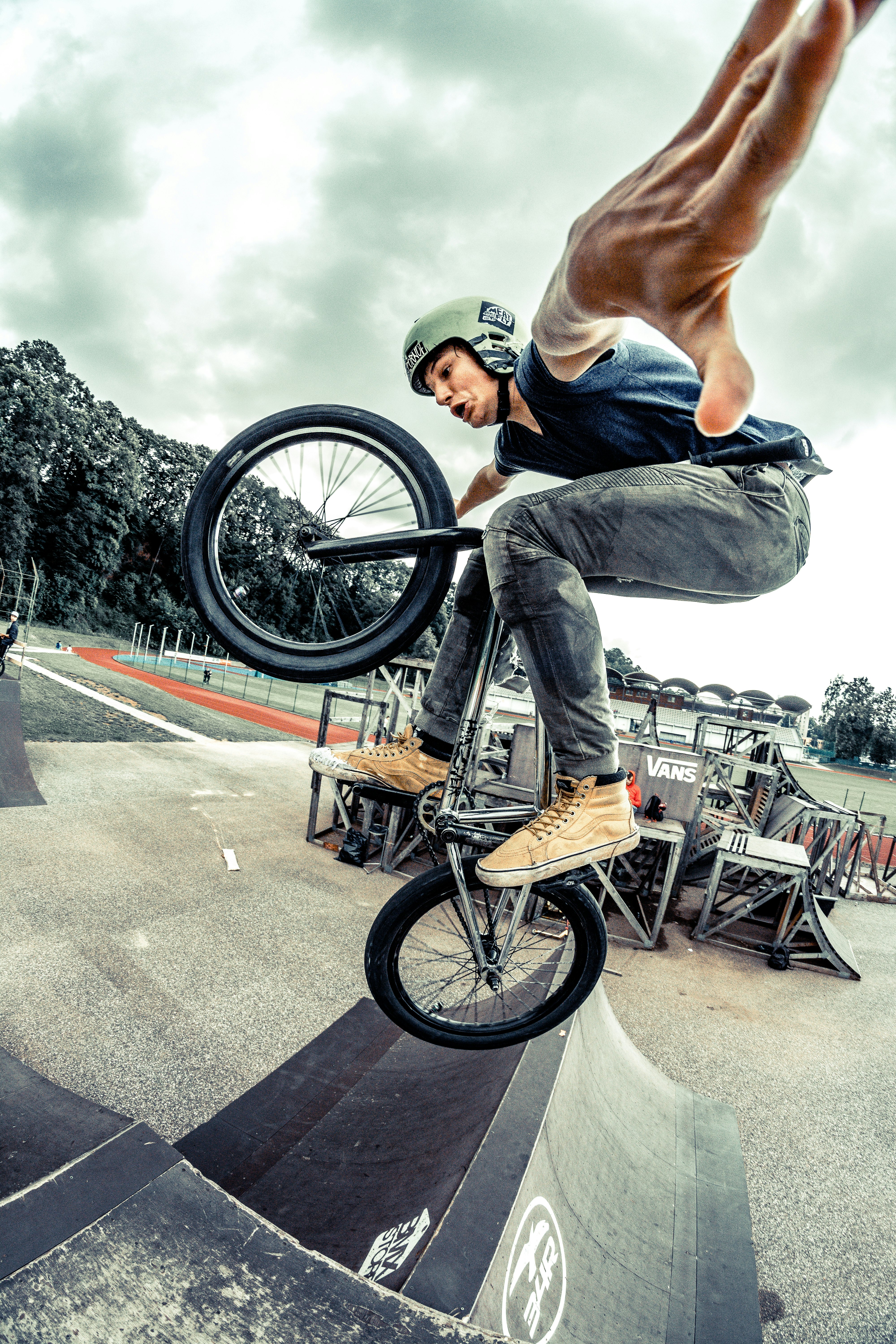 man riding bicycle while performing stunt